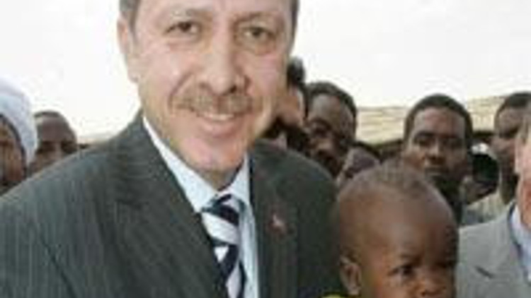 Erdogan, en route to Darfur, lashes out at Turkish media