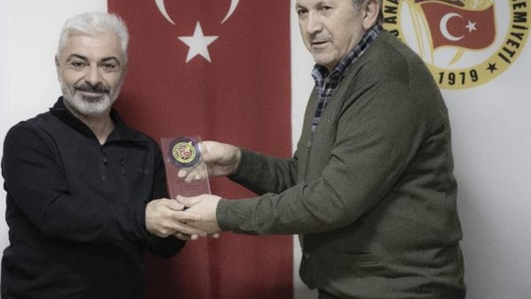 DAGCden DHA muhabirleri Polat ve Başlıya ödül