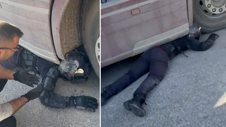 TIRın altında sıkıştı Kaskı ve koruyucu kıyafetleri sayesinde kurtuldu... Korkmuyorum, siz de korkmayın