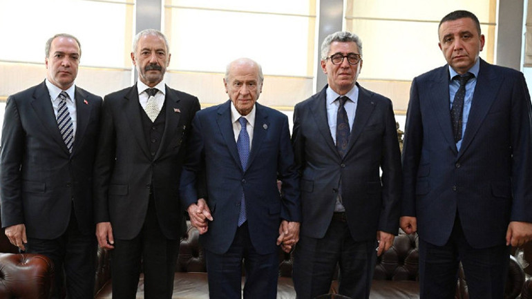Bahçeli, Sarallar ve Şahinler aileleriyle MHP Genel Merkezi’nde bir araya geldi
