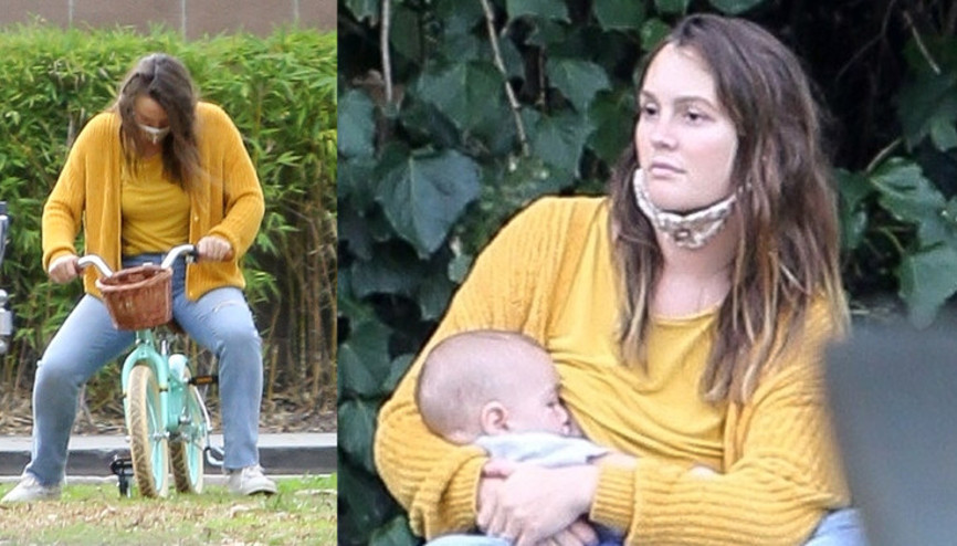 Bir kenarda bebeğini emzirdi