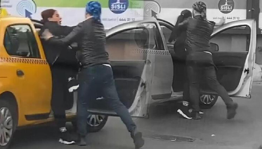 Taksideki kadın ile eğitmenin arbedesi kamerada