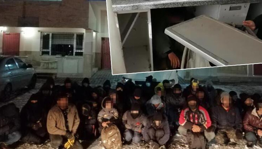 Vanda çamaşır makinesinin arkasına saklanan göçmen yakalandı