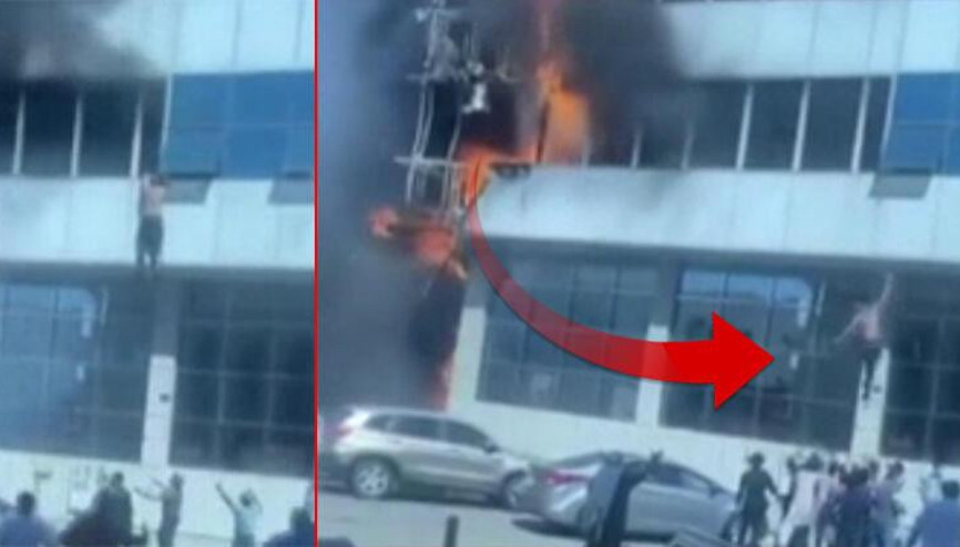 Yangından kurtulmak için metrelerce yüksekten atlayan adamı havada yakaladılar