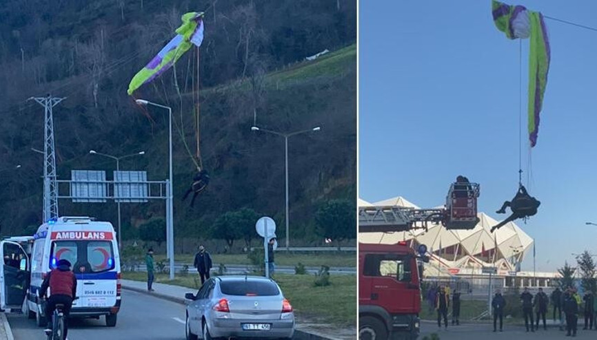 Paraşütçü, elektrik tellerinde asılı kaldı
