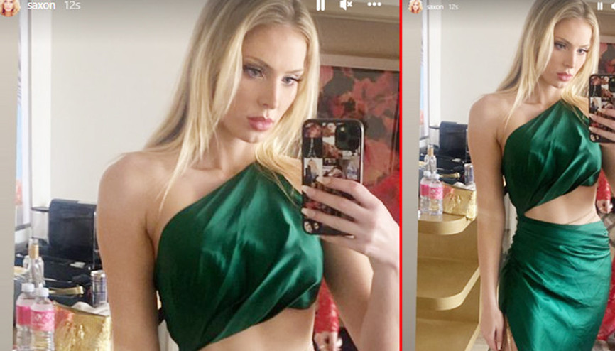 Biri market poşetiyle diğeri buruşuk elbiseyle kırmızı halıda