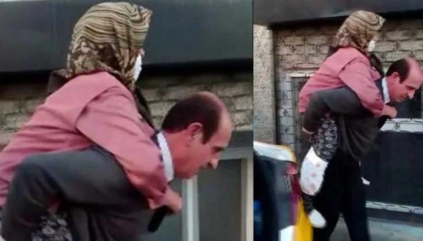 Yürekleri ısıtan görüntü: Taksici yaşlı kadını sırtında taşıdı
