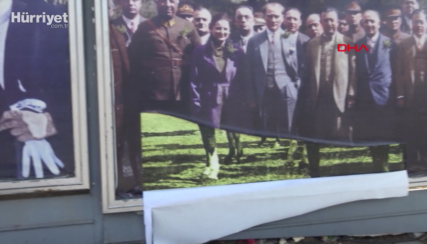 Atatürk posterlerini yırtanları 2 genç engelledi