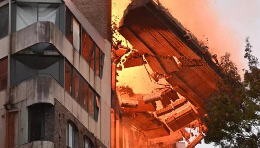 Avustralya’nın Sydney kentinde alevlerin sardığı binanın duvarı bir anda yıkıldı