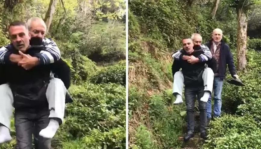 Muhtar, evine yol gitmeyen hasta köylüsünü sırtında taşıdı