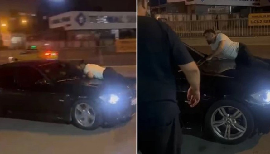 Kıskançlık krizine girdi, aracın kaputuna yatıp kalkmadı