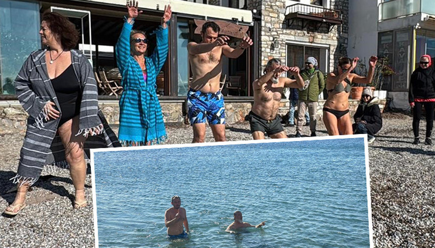 Yurdun büyük bölümünde kar teyakkuzu sürerken orada denize girdiler Yurdun büyük bölümünde kar teyakkuzu sürerken orada denize girdiler