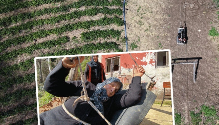 Yol olmayan eve çelik tel üzerinde tehlikeli yolculuk